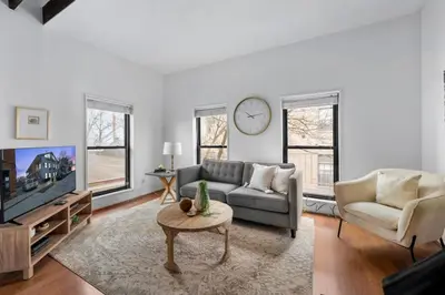 a living room with a couch and a tv at Charming Mt Adams 1BR in Prime Location in Cincinnati