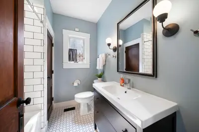 a bathroom with a sink and a mirror at Walkable 2BR near Findlay Market Downtown UC in Cincinnati