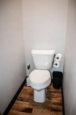 a bathroom with a toilet and two rolls of toilet paper at Great Parkside Microapartment Location AND Price in Cincinnati