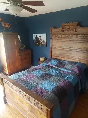 a bedroom with a large bed and a dresser at 4BR Home - Pets Allowed by ARK Experience in Williamstown