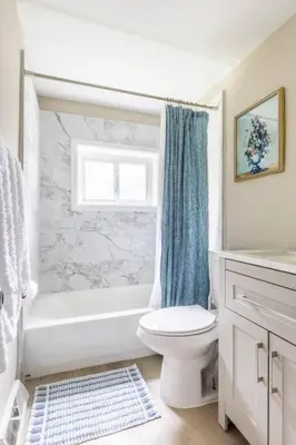a bathroom with a toilet and a tub and a sink at NEWLY Listed! Westlake Stylish in Westlake