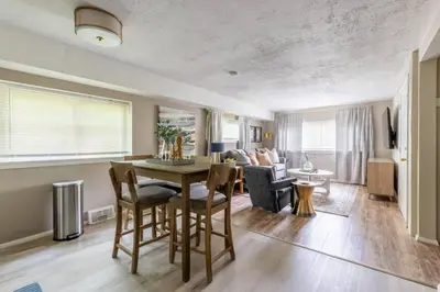 a dining room and living room with a table and chairs at NEWLY Listed! Westlake Stylish in Westlake