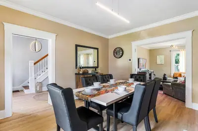 a dining room with a table and chairs at Modern Oakley Retreat - King Bed - Free Parking - Centrally Located in Cincinnati