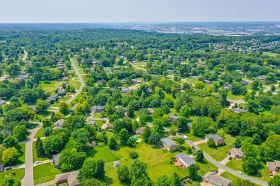 an aerial view of a residential neighborhood with houses and trees at Family-Friendly West Chester Twp Home with Pool! in West Chester