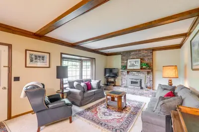 a living room with couches and a fireplace at Family-Friendly West Chester Twp Home with Pool! in West Chester