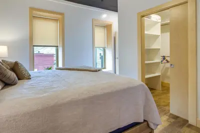a bedroom with a large bed and a window at Downtown Millersburg Retreat with Sleek Interior! in Millersburg