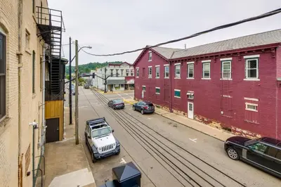 a city street with cars parked on the street at Downtown Millersburg Retreat with Sleek Interior! in Millersburg
