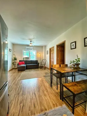 a living room with a couch and a table at Giriraja Ashraya in Moundsville