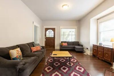 a living room with a couch and a coffee table at Stay with Jay Cleveland One in Cleveland