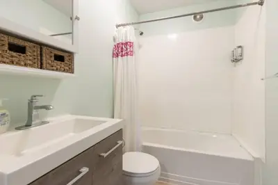 a bathroom with a sink and a toilet and a shower at Stay with Jay Cleveland One in Cleveland