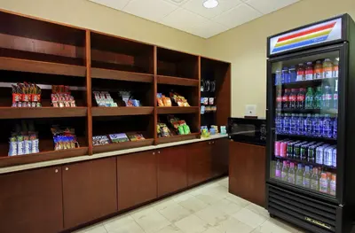 a store aisle with a soda machine in a store at Doubletree by Hilton Newark in Newark