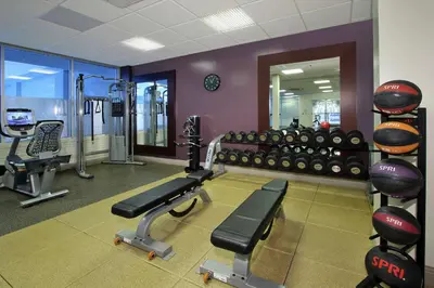 a fitness room with a gym with tread machines at Doubletree by Hilton Newark in Newark