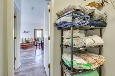 a room with a shelf filled with towels at Kentucky Retreat Near Williamstown Lake! in Williamstown