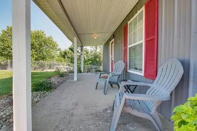 two chairs and a table on the porch of a house at Kentucky Retreat Near Williamstown Lake! in Williamstown