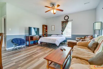 a living room with a couch and a table at Kentucky Retreat Near Williamstown Lake! in Williamstown