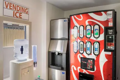 a coca cola vending machine in a room at Motel 75 Monroe in Monroe