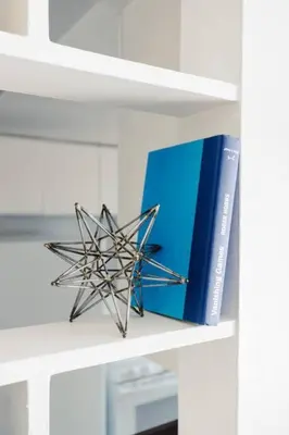 a book and a star sculpture on a shelf at Exclusive NEW Listing! Maple Heights Charm in Maple Heights