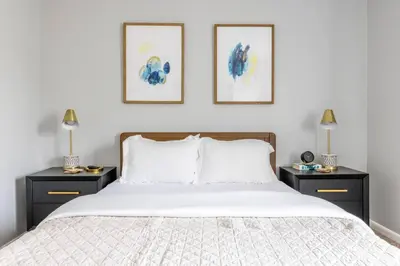 a bedroom with a bed with two night stands at Exclusive NEW Listing! Maple Heights Charm in Maple Heights