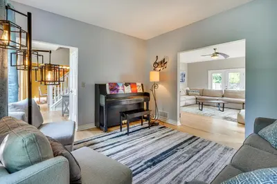 a living room with a piano and a couch at Spacious Lewis Center Home with Yard and Gas Grill! in Lewis Center