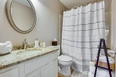 a bathroom with a sink and a toilet and a mirror at Spacious Lewis Center Home with Yard and Gas Grill! in Lewis Center