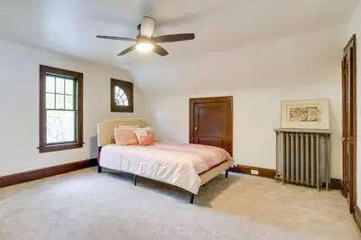 a bedroom with a bed and a ceiling fan at Cleveland Heights Retreat Close to Everything! in Cleveland Heights