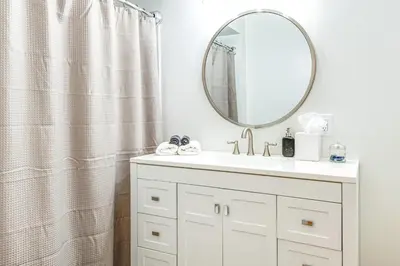 a bathroom with a sink and a mirror at 7 Mi to Mounds State Park Indiana Home with Porch! in Daleville
