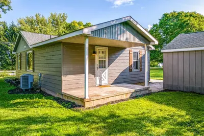 a small house with a porch on a yard at 7 Mi to Mounds State Park Indiana Home with Porch! in Daleville