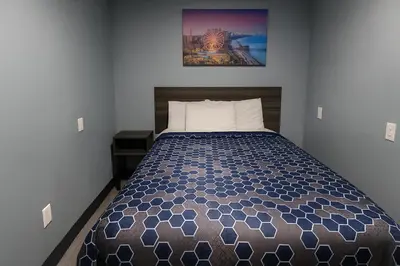 a bedroom with a bed in a room at Hillsboro Inn & Suites in Hillsboro