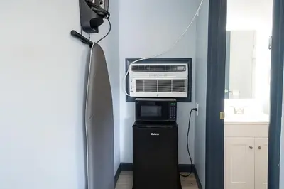 a room with a heater and a microwave in a room at Hillsboro Inn & Suites in Hillsboro