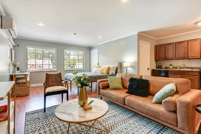 a living room with a couch and a table at Toledo Vacation Rental about 5 Mi to Downtown! in Toledo