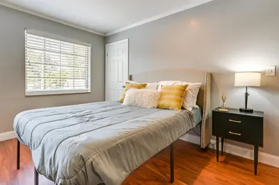 a bedroom with a large bed with a window at Toledo Vacation Rental about 5 Mi to Downtown! in Toledo