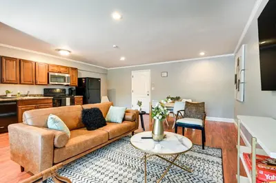 a living room with a couch and a table at Toledo Vacation Rental about 5 Mi to Downtown! in Toledo