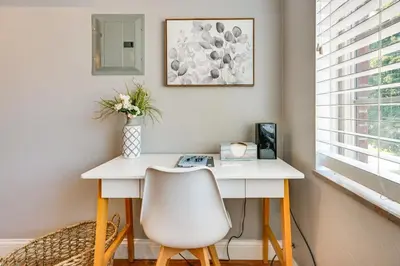 a white desk with a white chair in a room at Toledo Vacation Rental about 5 Mi to Downtown! in Toledo