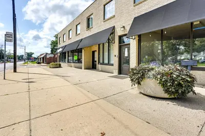 a building on a street with two plants in front of it at Toledo Vacation Rental about 5 Mi to Downtown! in Toledo