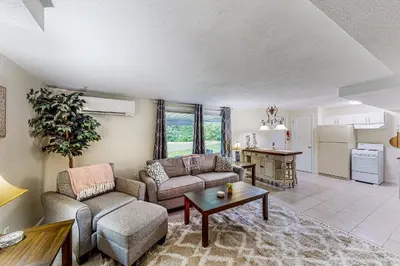 a living room with a couch and a table at River Access! Couples Retreat on Working Homestead in Woodburn