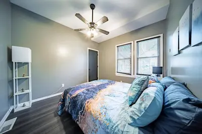 a bedroom with a bed and a ceiling fan at Little Italy Gem Close to CWRU, Cleveland Clinic & Top Restaurants w King Bed in Cleveland