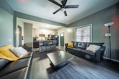 a living room with a couch and a ceiling fan at Little Italy Gem Close to CWRU, Cleveland Clinic & Top Restaurants w King Bed in Cleveland