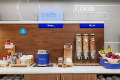 a kitchen with a counter with food on it at Holiday Inn Express & Suites Mansfield - Ontario by IHG in Mansfield
