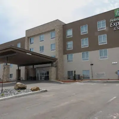 a hotel with a parking lot in front of a building at Holiday Inn Express & Suites Mansfield - Ontario by IHG in Mansfield