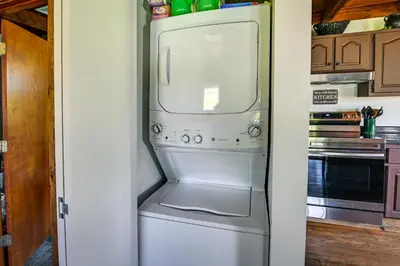 a refrigerator with a microwave in a kitchen at Creek, Trails and Falls! Rural Red River Gorge Cabin in Campton