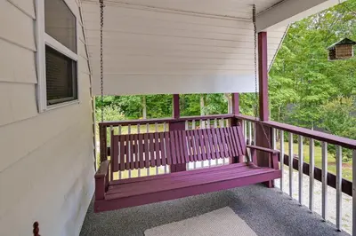 a purple bench on the porch of a house at Dog-Friendly Home Rental about 5 Mi to Cave Run Lake! in Wellington