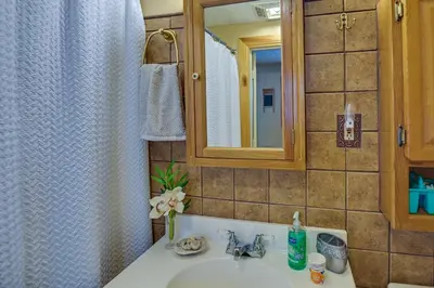 a bathroom with a sink and a mirror at Dog-Friendly Home Rental about 5 Mi to Cave Run Lake! in Wellington