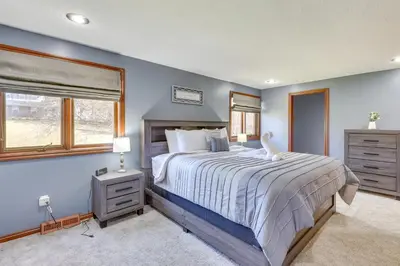 a bedroom with a large bed and a window at Bolivar Getaway Near Pro Football Hall of Fame! in Bolivar
