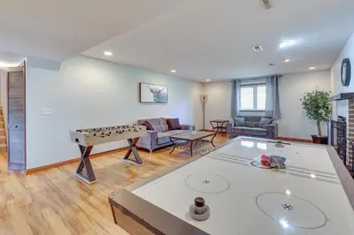 a living room with a ping pong table at Bolivar Getaway Near Pro Football Hall of Fame! in Bolivar