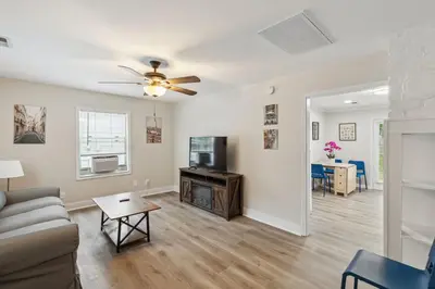 a living room with a couch and a table at Elm Two Bedroom House in Historic Loveland in Loveland