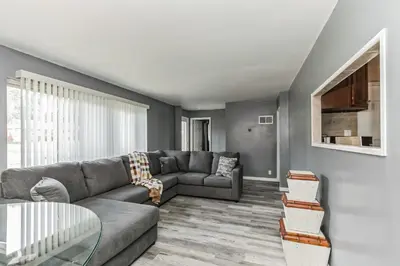 a living room with a couch and a table at Cozy Retreat in Cincinnati home in Cincinnati