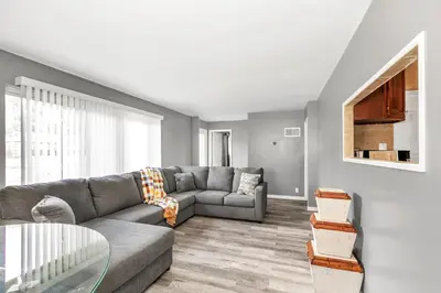 a living room with a couch and a glass table at Cozy Retreat in Cincinnati home in Cincinnati