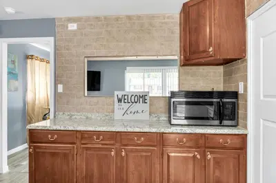 a kitchen with a microwave and a counter top at Cozy Retreat in Cincinnati home in Cincinnati