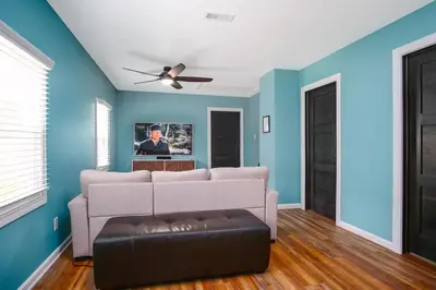 a living room with a couch and a ceiling fan at Buckeye Lake Cottage