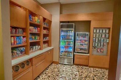 a store with two refrigerators in a room at SpringHill Suites by Marriott Canton in North Canton